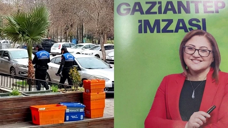 Zabıta Fatma Şahin'in seçim broşürlerini dağıtıyor