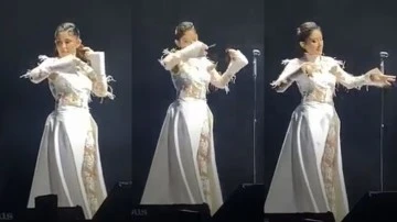 Melek Mosso İranlı kadınlara destek i&ccedil;in sahnede sa&ccedil;larını kesti