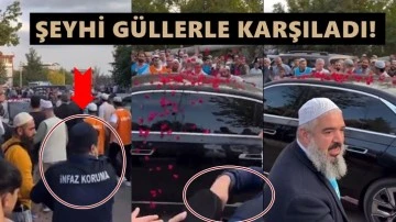 Menzil şeyhinin lüks aracına gül atan kamu görevlisi!