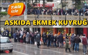 Yağmur altında askıda ekmek kuyruğu...